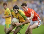 20 July 2014; Caolan McGonigle, Donegal, in action against Conor McNichol, Armagh. Electric Ireland Ulster GAA Football Minor Championship Final, Armagh v Donegal, St Tiernach's Park, Clones, Co. Monaghan. Picture credit: Oliver McVeigh / SPORTSFILE