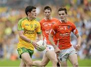 20 July 2014; Stephen McBrearty, Donegal, in action against Jarleth Og Burns, Armagh. Electric Ireland Ulster GAA Football Minor Championship Final, Armagh v Donegal, St Tiernach's Park, Clones, Co. Monaghan. Picture credit: Oliver McVeigh / SPORTSFILE