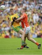 20 July 2014; Niall Harley, Donegal, in action against Jack Rafferty, Armagh. Electric Ireland Ulster GAA Football Minor Championship Final, Armagh v Donegal, St Tiernach's Park, Clones, Co. Monaghan. Picture credit: Oliver McVeigh / SPORTSFILE