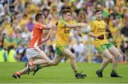 20 July 2014; Lorcan O'Connor, Donegal, in action against Cathal Donnelly, Armagh. Electric Ireland Ulster GAA Football Minor Championship Final, Armagh v Donegal, St Tiernach's Park, Clones, Co. Monaghan. Picture credit: Oliver McVeigh / SPORTSFILE