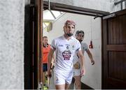 14 June 2014; Kildare's Mark Moloney, Mark Delaney, right, and manager Brian Lawlor, behind, emerge from the dressing rooms for the start of the second half. GAA All-Ireland Hurling Senior Championship Promotion Play Off, Westmeath v Kildare, Cusack Park, Mullingar, Co. Westmeath. Picture credit: Piaras Ó Mídheach / SPORTSFILE
