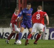 30 August 2006; Rory Hamill, Dungannon Swifts, in action against Barry Holland and George McMullan, Cliftonville. CIS Insurance Cup, Cliftonville v Dungannon Swifts, Solitude, Belfast, Co. Antrim. Picture credit: Oliver McVeigh / SPORTSFILE