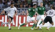 2 September 2006; Robbie Keane, Republic of Ireland, in action against Micael Ballack, left, and Bernd Schneider, Germany. Euro 2008 Championship Qualifier, Germany  v Republic of Ireland, Gottleib-Damlier Stadion, Stuttgart, Germany. Picture credit: Brian Lawless / SPORTSFILE