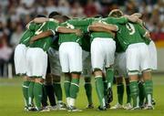 2 September 2006; The Republic of Ireland team form a huddle before the start of the game. Euro 2008 Championship Qualifier, Germany  v Republic of Ireland, Gottleib-Damlier Stadion, Stuttgart, Germany. Picture credit: David Maher / SPORTSFILE