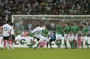 2 September 2006; Germany’s Lukas Podolski has his free kick deflected into the Irish goal off the heel of Robbie Keane, left , Republic of Ireland, to score his side’s first goal. Euro 2008 Championship Qualifier, Germany  v Republic of Ireland, Gottleib-Damlier Stadion, Stuttgart, Germany. Picture credit: David Maher / SPORTSFILE
