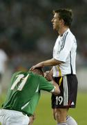 2 September 2006; Damien Duff, Republic of Ireland, with Bernd Schneider, Germany, at the end of the game. Euro 2008 Championship Qualifier, Germany  v Republic of Ireland, Gottleib-Damlier Stadion, Stuttgart, Germany. Picture credit: David Maher / SPORTSFILE