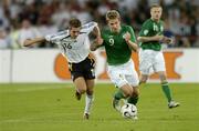 2 September 2006; Kevin Doyle, Republic of Ireland, in action against Philipp Lahm, Germany. Euro 2008 Championship Qualifier, Germany v Republic of Ireland, Gottleib-Damlier Stadion, Stuttgart, Germany. Picture credit: David Maher / SPORTSFILE