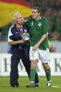 2 September 2006; Republic of Ireland's Richard Dunne with team physio Mick Byrne after the match. Euro 2008 Championship Qualifier, Germany  v Republic of Ireland, Gottleib-Damlier Stadion, Stuttgart, Germany. Picture credit: Brian Lawless / SPORTSFILE