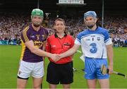 19 July 2014; Wexford captain Matthew O'Hanlon shakes hands with Waterford captain Michael Walsh with referee Colm Lyons. GAA Hurling All Ireland Senior Championship, Round 2, Waterford v Wexford, Nowlan Park, Kilkenny. Picture credit: Ray McManus / SPORTSFILE