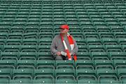 13 July 2014; A Cork supporter waits for the games to begin. Munster GAA Hurling Senior Championship Final, Cork v Limerick, Pairc Uí Chaoimh, Cork. Picture credit: Ray McManus / SPORTSFILE