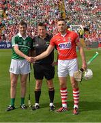 13 July 2014; Cork captain Patrick Cronin and Limerick captain Donal O'Grady shake hands before the game, infront of referee Brian Gavin. Munster GAA Hurling Senior Championship Final, Cork v Limerick, Pairc Uí Chaoimh, Cork. Picture credit: Ray McManus / SPORTSFILE