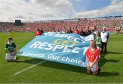 13 July 2014; Officials and children display the GAA 'Give Respect Get Respect' flag before the game. Munster GAA Hurling Senior Championship Final, Cork v Limerick, Pairc Uí Chaoimh, Cork. Picture credit: Ray McManus / SPORTSFILE