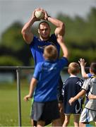 23 July 2014; Leinster's Rhys Ruddock looks to pass the ball to a participant during The Herald Leinster Rugby Summer Camps in Portlaoise RFC, Co. Laois. Picture credit: Barry Cregg / SPORTSFILE