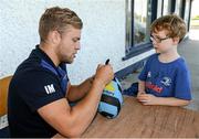 23 July 2014; Sean Hayes, aged 7, from Portlaoise, Co. Laois, has his rugby ball signed by Leinster's Ian Madigan during The Herald Leinster Rugby Summer Camps in Portlaoise RFC, Co. Laois. Picture credit: Barry Cregg / SPORTSFILE