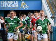 22 July 2014; Limerick players including Andrew La Touche Cosgrave, left, and captain Cian Lynch make their way out for the start of the game. Electric Ireland Munster GAA Hurling Minor Championship Final Replay, Waterford v Limerick, Semple Stadium, Thurles, Co. Tipperary. Picture credit: Diarmuid Greene / SPORTSFILE