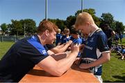 23 July 2014; Ruairi McDonald gets an autograph from Leinster player Tom Denton during The Herald Leinster Rugby Summer Camps in Seapoint RFC, Killiney, Co. Dublin. Picture credit: Matt Browne / SPORTSFILE