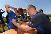 23 July 2014; Ben O'Keefe gets an autograph from Leinster player Jamie Heaslip during The Herald Leinster Rugby Summer Camps in Seapoint RFC, Killiney, Co. Dublin. Picture credit: Matt Browne / SPORTSFILE