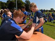 23 July 2014; Daragh McCaul gets an autograph from Leinster player Tom Denton during The Herald Leinster Rugby Summer Camps in Seapoint RFC, Killiney, Co. Dublin. Picture credit: Matt Browne / SPORTSFILE