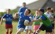 23 July 2014; Eoin Brophy is tackled by Mark McDermott during The Herald Leinster Rugby Summer Camps in Tullow RFC, Tullow, Co. Carlow. Picture credit: Matt Browne / SPORTSFILE