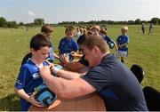 23 July 2014; Ryan Fitzgerald gets an autograph from Leinster player Tadhg Furlong during The Herald Leinster Rugby Summer Camps in Tullow RFC, Tullow, Co. Carlow. Picture credit: Matt Browne / SPORTSFILE