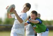 23 July 2014; Cian Byrne is tackled by James Whelan during The Herald Leinster Rugby Summer Camps in Tullow RFC, Tullow, Co. Carlow. Picture credit: Matt Browne / SPORTSFILE