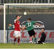 23 July 2014; Legia Warszaw's Michal Zyro beats St Patrick's Athletic goalkeeper Brendan Clarke to score his side's second goal. UEFA Champions League, Second Qualifying Round, Second Leg, St Patrick's Athletic v Legia Warszawa, Tallaght Stadium, Tallaght, Co. Dublin. Picture credit: David Maher / SPORTSFILE