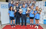 24 July 2014; Representatives of Dublin’s recent Leinster Championship winning football teams paid a visit to the offices of Dublin GAA sponsor AIG today to celebrate their success. Dublin teams at minor, Under-21 and senior level in both male and female codes have secured provincial honours already this summer with the Under-21 sides both going on to win All Ireland titles. Players in attendance were, from left, Lyndsey Davey, Ladies Senior Footballer, Lorcan Molloy, U-21 Footballer, Paddy Andrews Senior Footballer, Martha Byrne, U-21 Ladies Footballer, and Aoife Curran, Ladies Minor Footballer, who were all on hand for the event with the silverware they have won. AIG has also launched exclusive car, home and travel insurance rates for GAA club members at www.aig.ie/dubs. Picture credit: Brendan Moran / SPORTSFILE