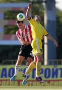 24 July 2014; Cliff Byrne, Derry City, and Nikolai Yanush, Shakhtyor Soligorsk, contest a loose ball. UEFA Champions League, Second Qualifying Round, Second Leg, Shakhtyor Soligorsk v Derry City, Stroitel Stadium, Soligorsk, Belarus. Picture credit: Tatiana Zenkovich / SPORTSFILE