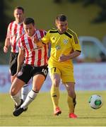 24 July 2014; Patrick McEleney, Derry City, in action against Aleksei Rios, Shakhtyor Soligorsk. UEFA Champions League, Second Qualifying Round, Second Leg, Shakhtyor Soligorsk v Derry City, Stroitel Stadium, Soligorsk, Belarus. Picture credit: Tatiana Zenkovich / SPORTSFILE