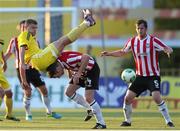 24 July 2014; Nikolai Yanush, Shakhtyor Soligorsk, in action against Barry Molloy and Ryan McBride, right, Derry City. UEFA Champions League, Second Qualifying Round, Second Leg, Shakhtyor Soligorsk v Derry City, Stroitel Stadium, Soligorsk, Belarus. Picture credit: Tatiana Zenkovich / SPORTSFILE