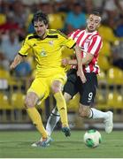 24 July 2014; Aleksei Yanushkevich, Shakhtyor Soligorsk, in action against Nathan Boyle, Derry City. UEFA Champions League, Second Qualifying Round, Second Leg, Shakhtyor Soligorsk v Derry City, Stroitel Stadium, Soligorsk, Belarus. Picture credit: Tatiana Zenkovich / SPORTSFILE