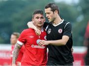 24 July 2014; A dejected Sean Maguire, left, Sligo Rovers, is consoled at the end of the game by a member of the backroom staff. UEFA Champions League, Second Qualifying Round, Second Leg, Sligo Rovers v Rosenborg, Showgrounds, Sligo. Picture credit: David Maher / SPORTSFILE