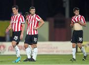 24 July 2014; Dejected Derry City players, from left, Cliff Byrne, Patrick McEleney and Aaron Barry after the game. UEFA Champions League, Second Qualifying Round, Second Leg, Shakhtyor Soligorsk v Derry City, Stroitel Stadium, Soligorsk, Belarus. Picture credit: Tatiana Zenkovich / SPORTSFILE