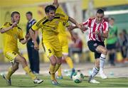 24 July 2014; Nathan Boyle, Derry City, in action against Aleksei Yanushkevich, centre, and Sergei Matveychik, Shakhtyor Soligorsk. UEFA Champions League, Second Qualifying Round, Second Leg, Shakhtyor Soligorsk v Derry City, Stroitel Stadium, Soligorsk, Belarus. Picture credit: Tatiana Zenkovich / SPORTSFILE