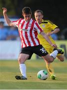 24 July 2014; Aaron Barry, Derry City, in action against Sergei Balanovich, Shakhtyor Soligorsk. UEFA Champions League, Second Qualifying Round, Second Leg, Shakhtyor Soligorsk v Derry City, Stroitel Stadium, Soligorsk, Belarus. Picture credit: Tatiana Zenkovich / SPORTSFILE