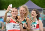26 July 2014; Niamh Quinn from Portlaoise AC, who came third in the girls under-19 800m, takes a 'selfie' with second place Anna Sheehan from Kilkenny City Harriers AC and winner of the race Alanna Lally from Galway City Harriers AC. GloHealth Juvenile Track and Field Championships, Tullamore Harriers AC, Tullamore, Co. Offaly. Picture credit: Matt Browne / SPORTSFILE