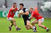 26 July 2014; Pat Hughes, Sligo, in action against Colm O'Driscoll, left, and Michael Shields, Cork. GAA Football All Ireland Senior Championship, Round 4A, Cork v Sligo. O'Connor Park, Tullamore, Co. Offaly. Picture credit: Ramsey Cardy / SPORTSFILE