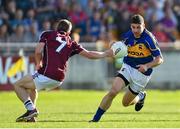 26 July 2014; Philip Austin, Tipperary, in action against Paul Varley, Galway. GAA Football All Ireland Senior Championship, Round 4A, Galway v Tipperary. O'Connor Park, Tullamore, Co. Offaly. Picture credit: Ramsey Cardy / SPORTSFILE
