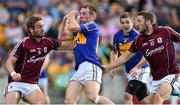 26 July 2014; Peter Acheson, Tipperary, in action against Gary O'Donnell, left, and Michael Lundy, Galway. GAA Football All Ireland Senior Championship, Round 4A, Galway v Tipperary. O'Connor Park, Tullamore, Co. Offaly. Picture credit: Ramsey Cardy / SPORTSFILE