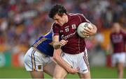 26 July 2014; Daithí Burke, Galway, in action against Conor Sweeney, Tipperary. GAA Football All Ireland Senior Championship, Round 4A, Galway v Tipperary. O'Connor Park, Tullamore, Co. Offaly. Picture credit: Barry Cregg / SPORTSFILE