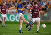 26 July 2014; Colin O'Riordan, Tipperary, shoots to score his side's third goal of the game despite the challenge from Gareth Bradshaw, Galway. GAA Football All Ireland Senior Championship, Round 4A, Galway v Tipperary. O'Connor Park, Tullamore, Co. Offaly. Picture credit: Barry Cregg / SPORTSFILE