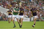 27 July 2014; Tom Condon, Limerick, in action against Paul Morris and Lee Chin, right, Wexford. GAA Hurling All Ireland Senior Championship Quarter-Final, Limerick v Wexford. Semple Stadium, Thurles, Co. Tipperary Picture credit: Diarmuid Greene / SPORTSFILE