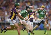 27 July 2014; Declan Hannon, Limerick, in action against Keith Rossiter, Wexford. GAA Hurling All Ireland Senior Championship Quarter-Final, Limerick v Wexford. Semple Stadium, Thurles, Co. Tipperary. Picture credit: Ray McManus / SPORTSFILE