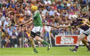 27 July 2014; David Breen, Limerick, shoots to score his side's first goal despite the efforts of Ciaran Kenny, Wexford. GAA Hurling All Ireland Senior Championship Quarter-Final, Limerick v Wexford. Semple Stadium, Thurles, Co. Tipperary. Picture credit: Diarmuid Greene / SPORTSFILE