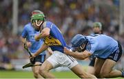 27 July 2014; James Woodlock, Tipperary, in action against Stephen Hiney, Dublin. GAA Hurling All Ireland Senior Championship Quarter-Final, Tipperary v Dublin. Semple Stadium, Thurles, Co. Tipperary. Picture credit: Dáire Brennan / SPORTSFILE