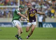 27 July 2014; Thomas Ryan, Limerick, in action against Lee Chin, Wexford. GAA Hurling All Ireland Senior Championship Quarter-Final, Limerick v Wexford. Semple Stadium, Thurles, Co. Tipperary. Picture credit: Dáire Brennan / SPORTSFILE