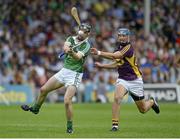 27 July 2014; Seán Tobin, Limerick, in action against Ian Byrne, Wexford. GAA Hurling All Ireland Senior Championship Quarter-Final, Limerick v Wexford. Semple Stadium, Thurles, Co. Tipperary. Picture credit: Dáire Brennan / SPORTSFILE