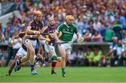 27 July 2014; Paul Browne, Limerick, runs past Andrew Shore, Wexford, on his way to score the fourth goal. GAA Hurling All Ireland Senior Championship Quarter-Final, Limerick v Wexford. Semple Stadium, Thurles, Co. Tipperary. Picture credit: Ray McManus / SPORTSFILE