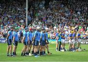 27 July 2014; The Dublin and Tipperary teams stand together for the national anthem. GAA Hurling All Ireland Senior Championship Quarter-Final, Tipperary v Dublin. Semple Stadium, Thurles, Co. Tipperary. Picture credit: Dáire Brennan / SPORTSFILE