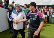 27 July 2014; Wexford manager Liam Dunne exchanges a handshake after the game with umpire Michael Coyle from Mullingar, Co. Westmeath. GAA Hurling All Ireland Senior Championship Quarter-Final, Limerick v Wexford. Semple Stadium, Thurles, Co. Tipperary. Picture credit: Diarmuid Greene / SPORTSFILE